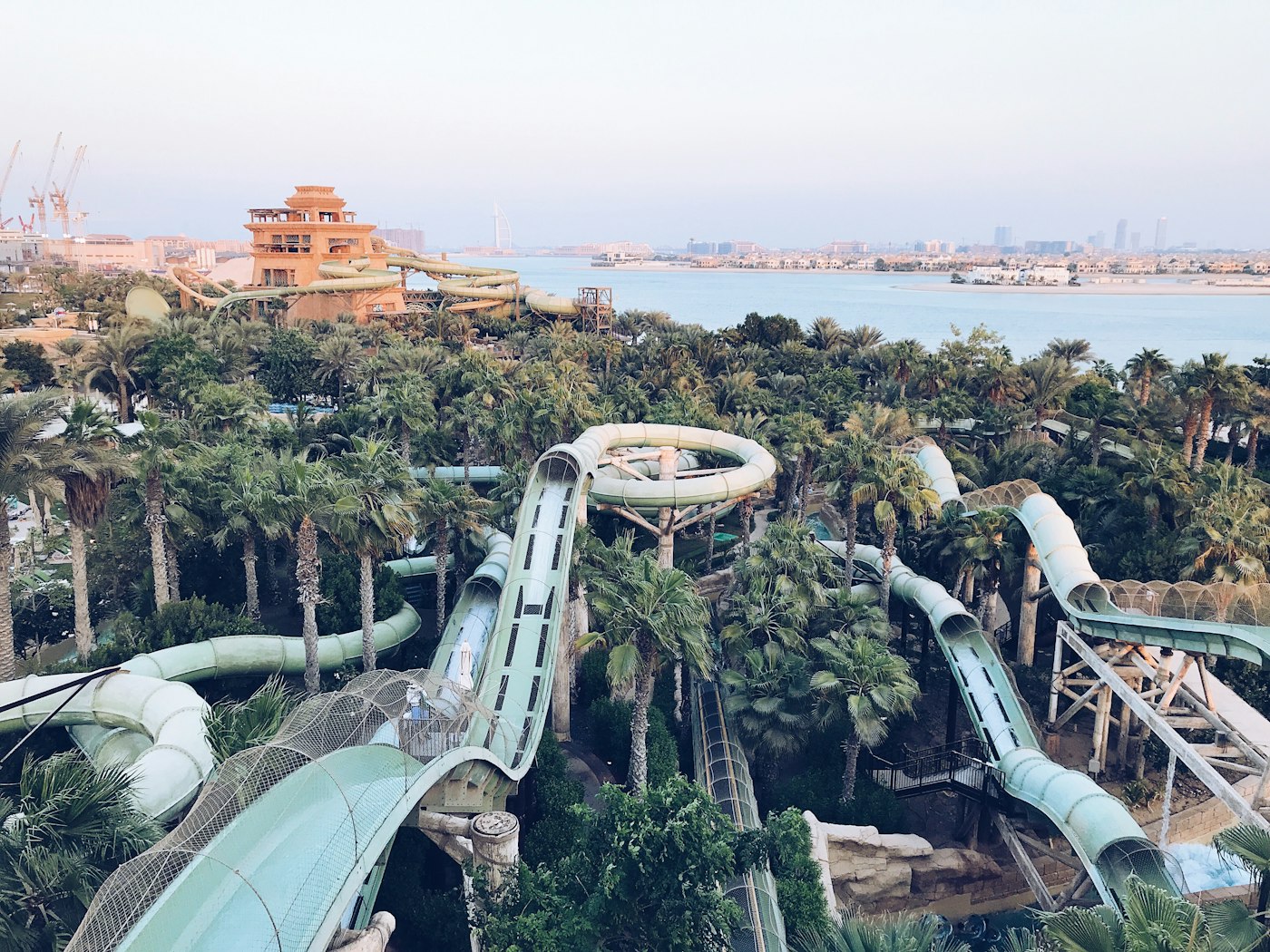 Water slides and palm trees at Aquaventure Waterpark at Atlantis The Palm Dubai