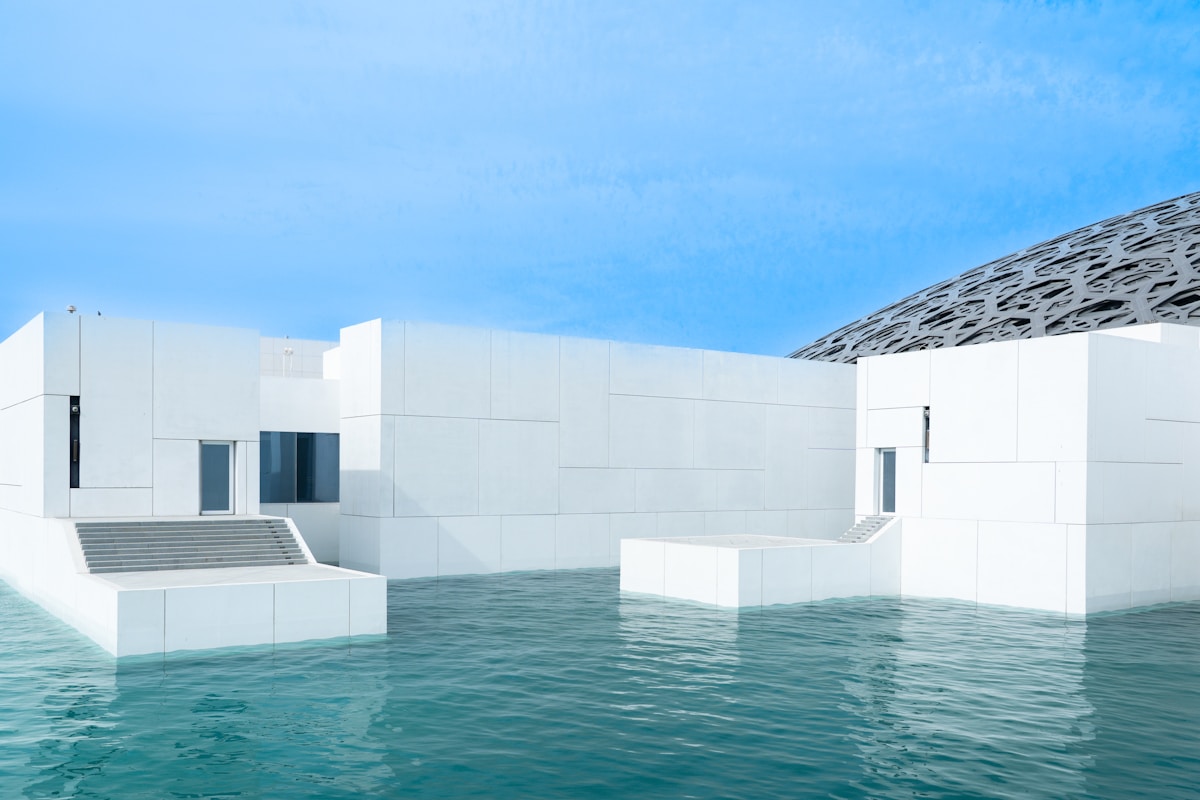 Louvre Abu Dhabi museum with distinctive dome architecture over water, Saadiyat Island