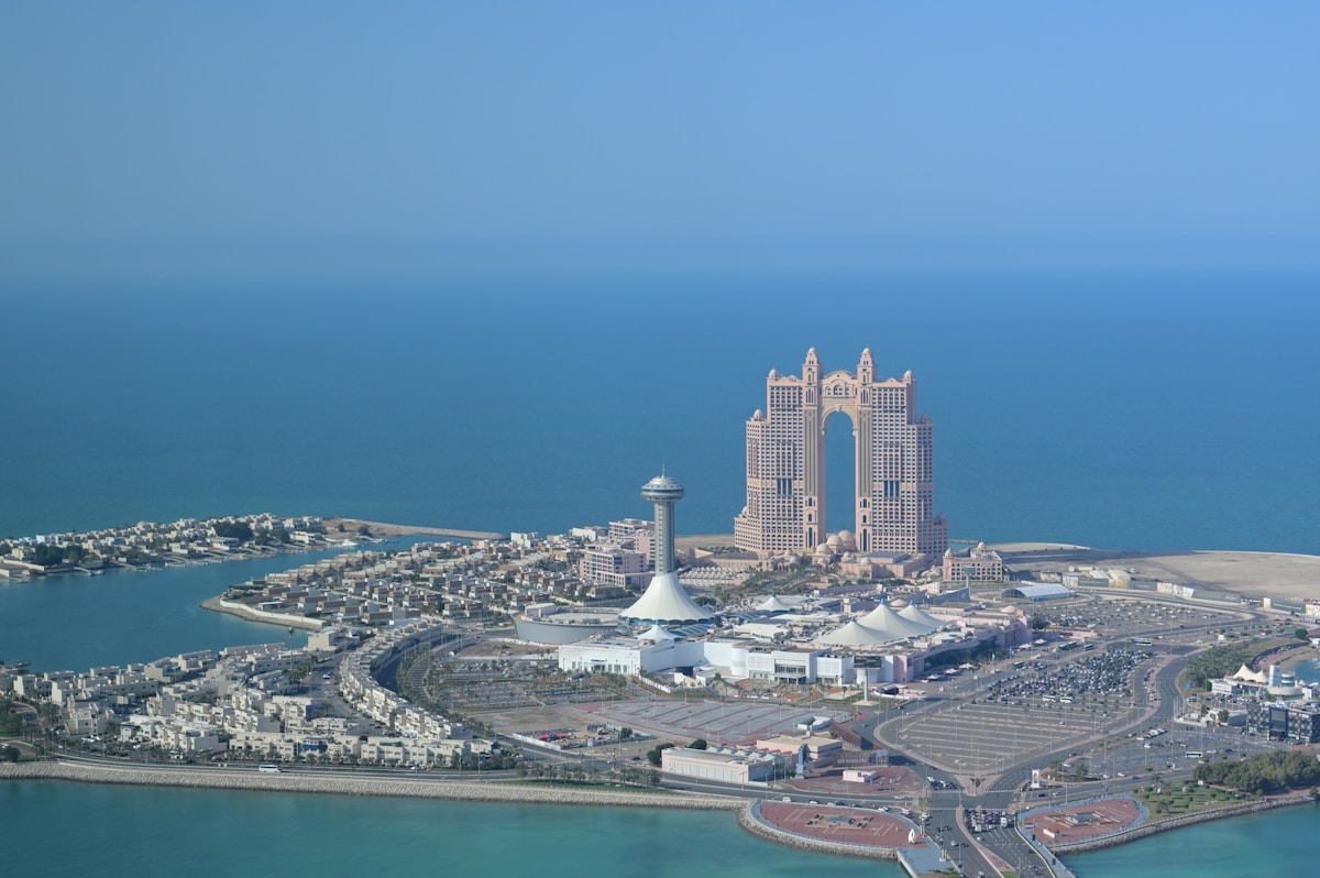 Aerial view of Abu Dhabi marina coastline with Fairmont hotel and Arabian Gulf, UAE