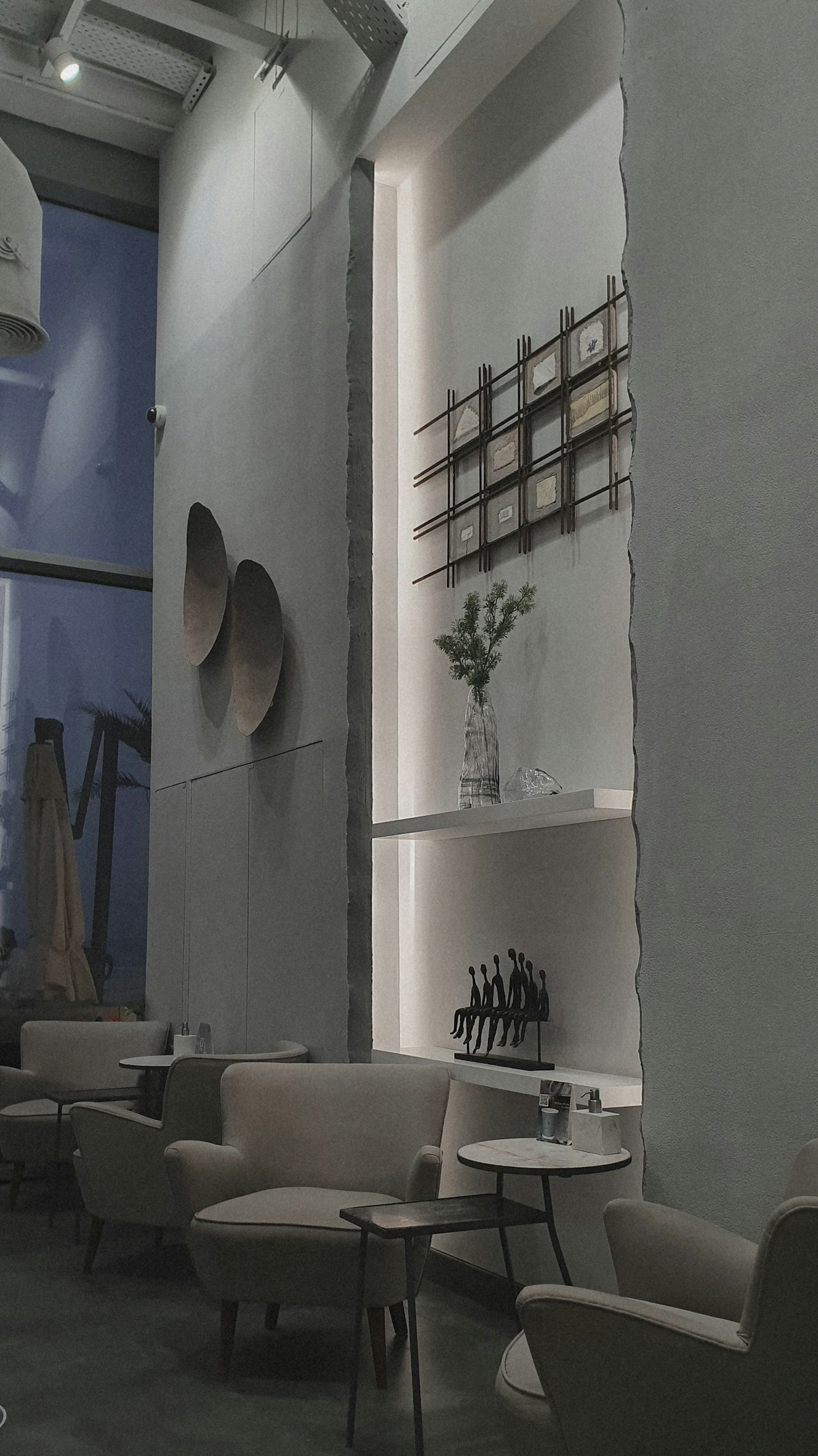 Minimalist café interior with table and chairs, Abu Dhabi UAE