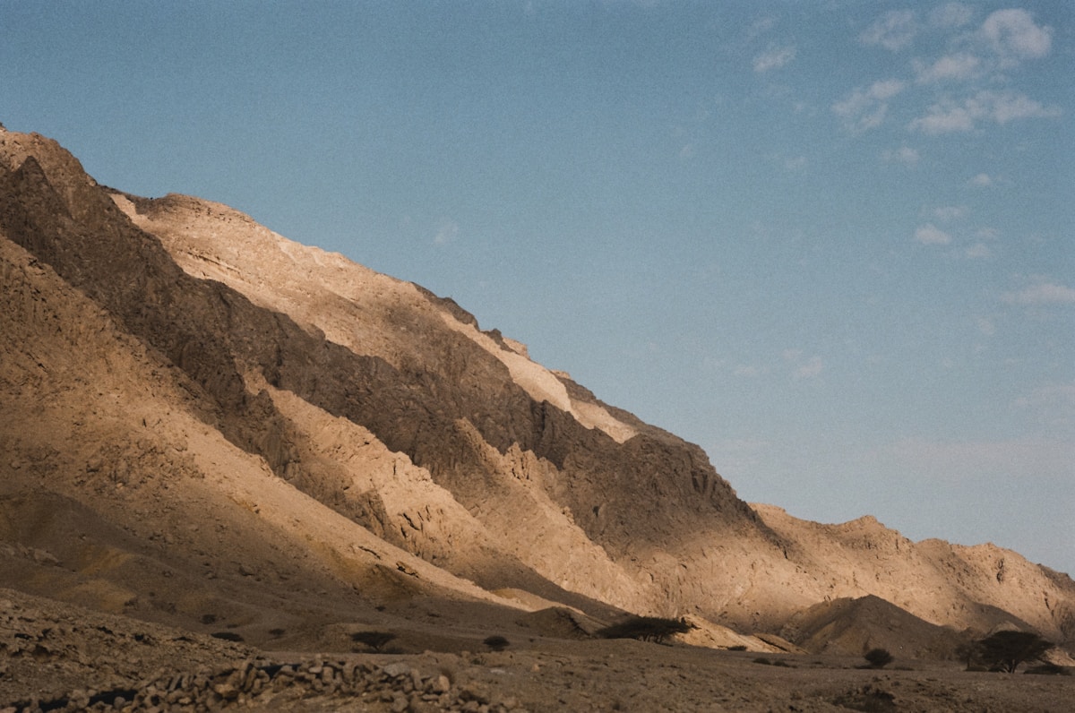 Sunlit rocky slopes of Jebel Hafeet mountain in Al Ain, UAE
