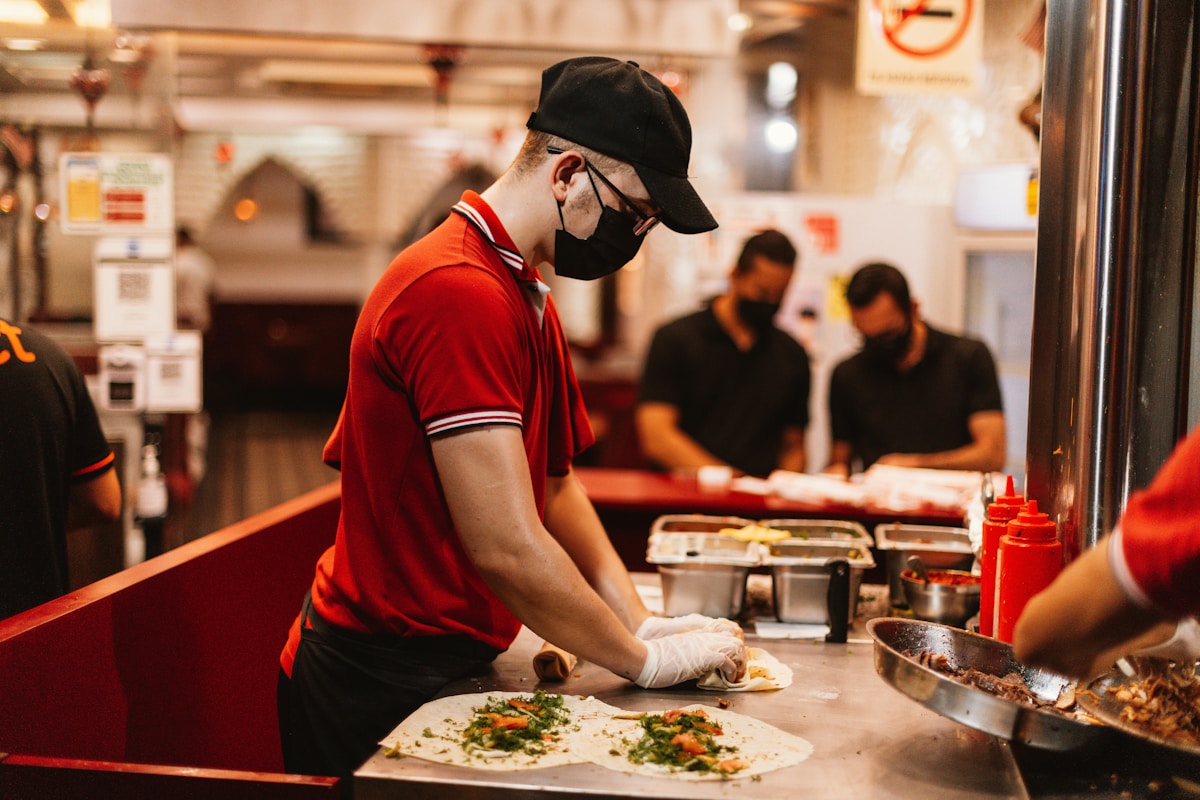 Chef preparing food in a modern restaurant kitchen Dubai UAE
