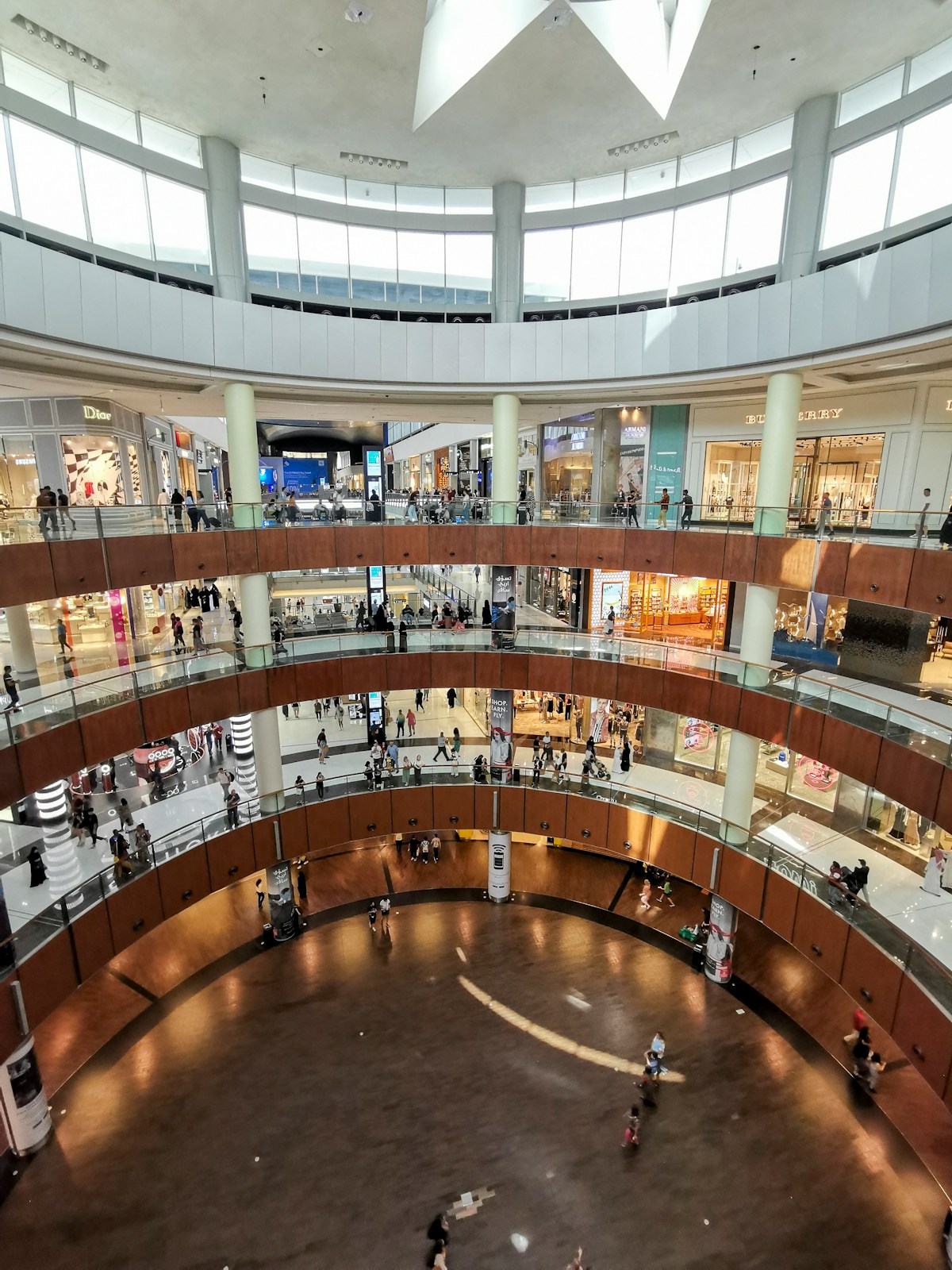 Overhead view of shoppers walking through a busy mall in Dubai UAE