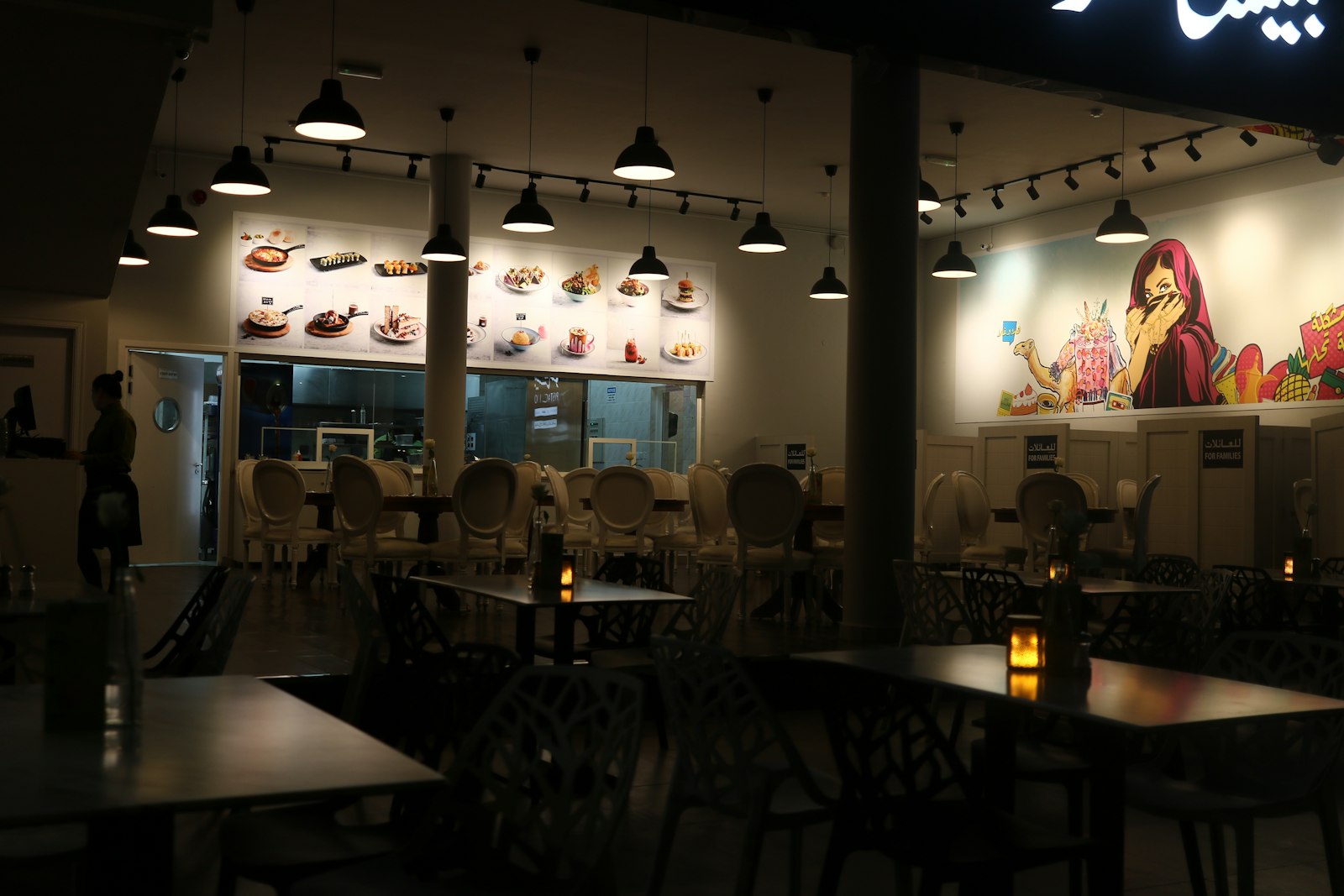 Modern UAE restaurant interior with Arabic wall art and pendant lighting Fujairah