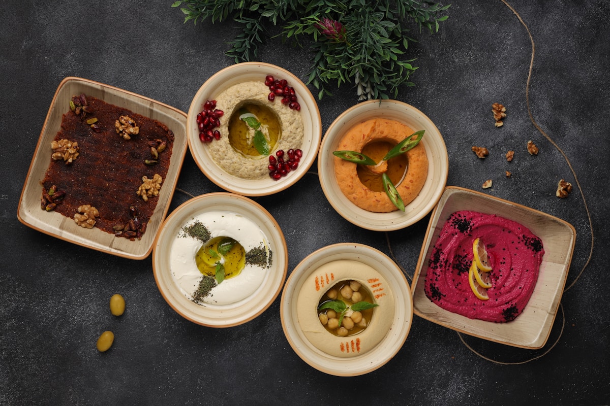 Assortment of Arabic mezze dips and dishes on a table, Ras Al Khaimah UAE