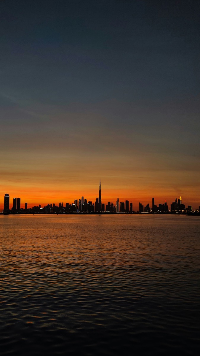 Dubai Downtown skyline at dusk with Burj Khalifa towering above