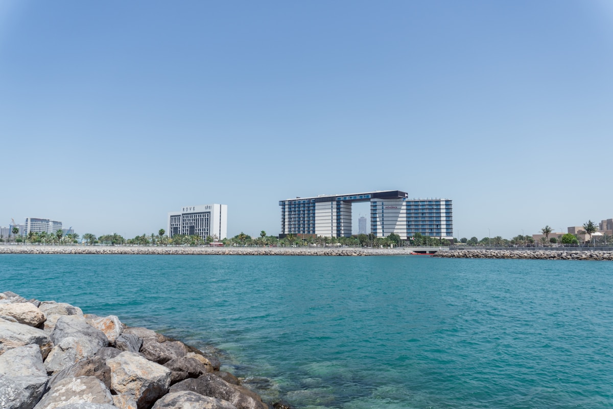 Low-rise buildings along a quiet Arabian Gulf waterfront in Umm Al Quwain, UAE
