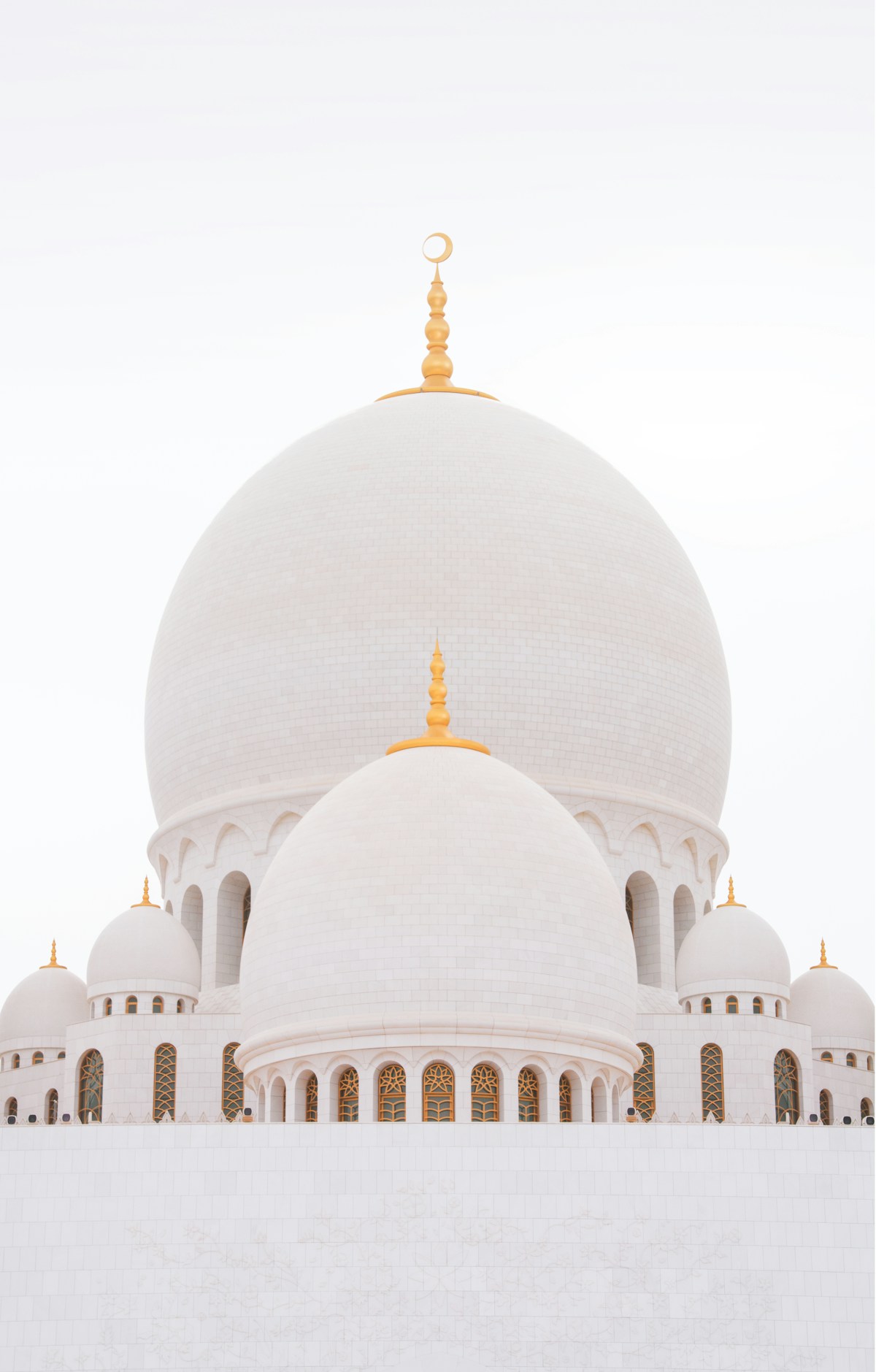 Sheikh Zayed Grand Mosque white and gold domes in Abu Dhabi, UAE