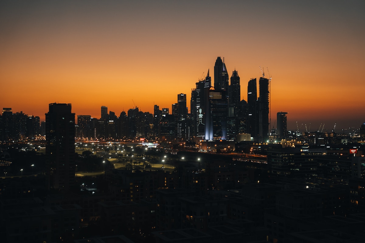 Dubai city skyline at dusk with warm evening glow UAE luxury