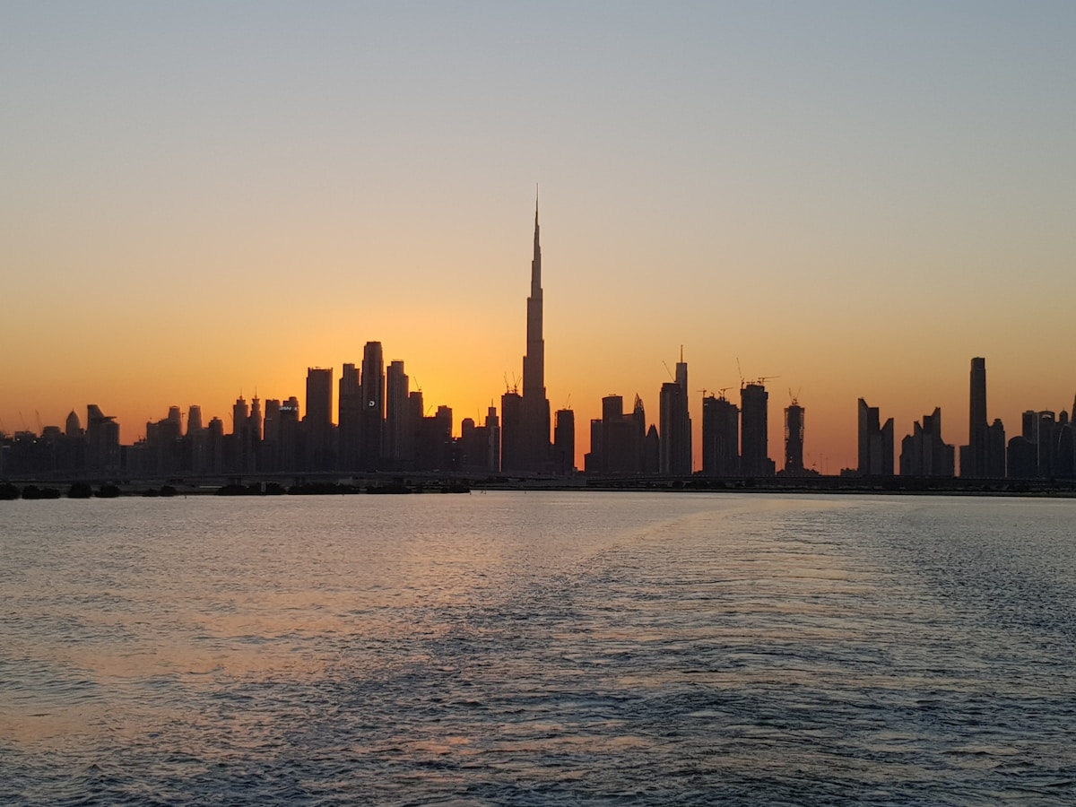 Dubai skyline at dusk with warm winter sky UAE January