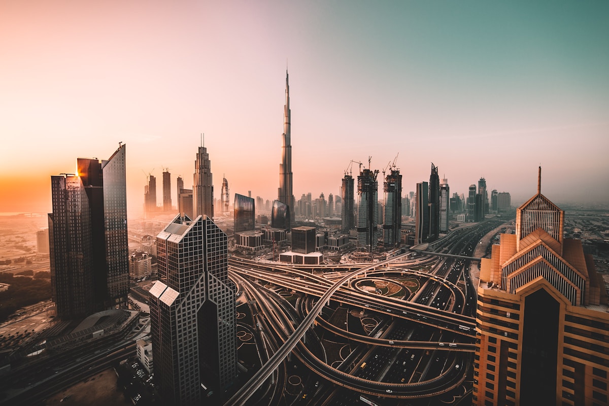 Aerial view of Dubai city highway lined with high-rise skyscrapers, UAE