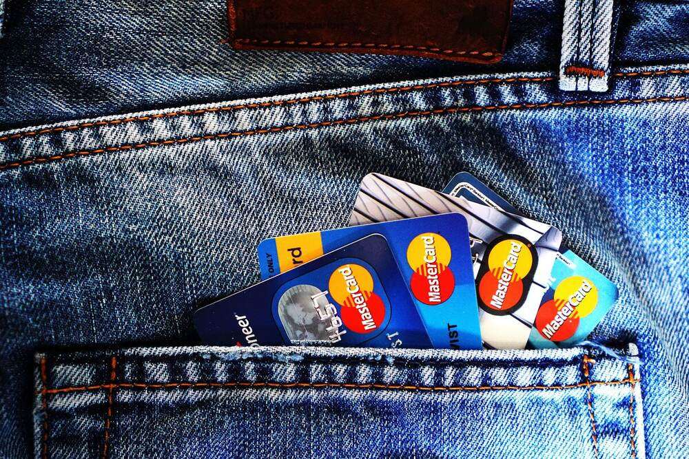 Travel credit cards stacked in jeans pocket for UAE resident frequent travellers