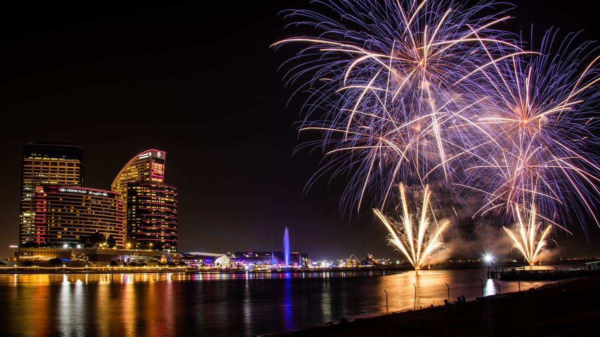 Fireworks over the Dubai waterfront at night