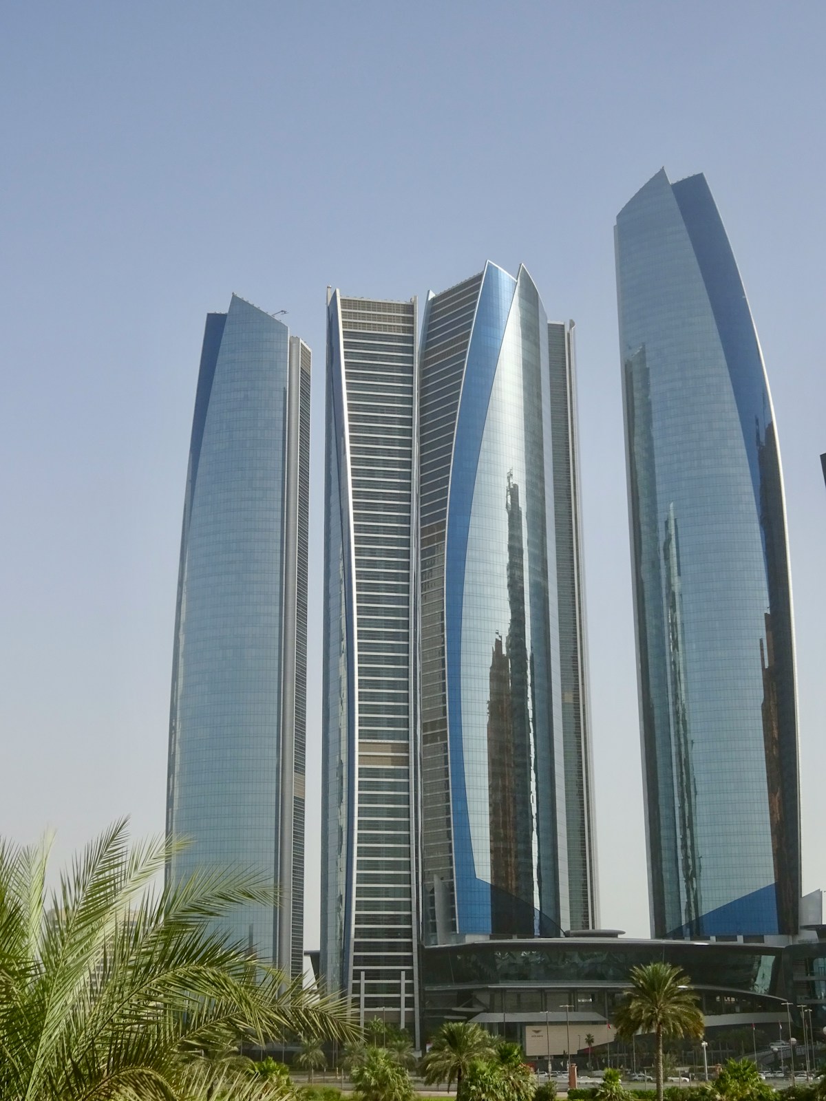 Etihad Towers skyscrapers rising above Abu Dhabi city centre against a clear sky