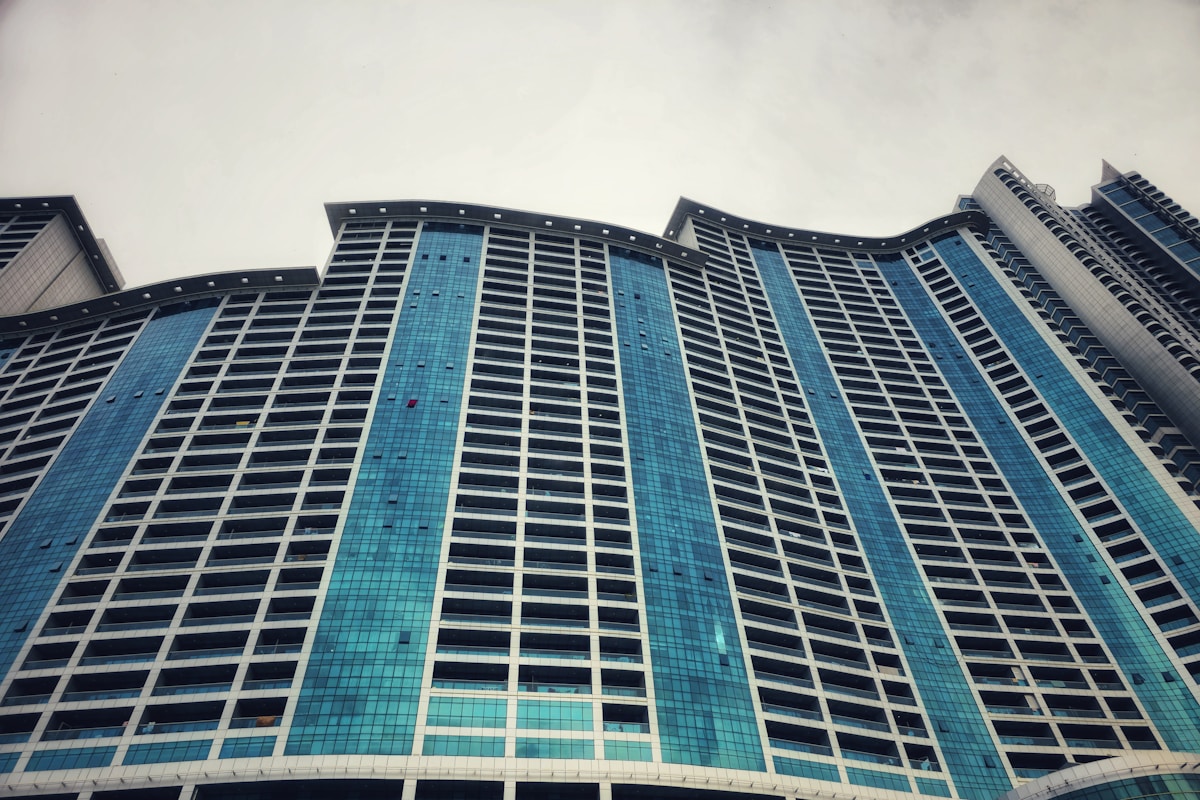 Modern glass hotel tower in Ajman, UAE