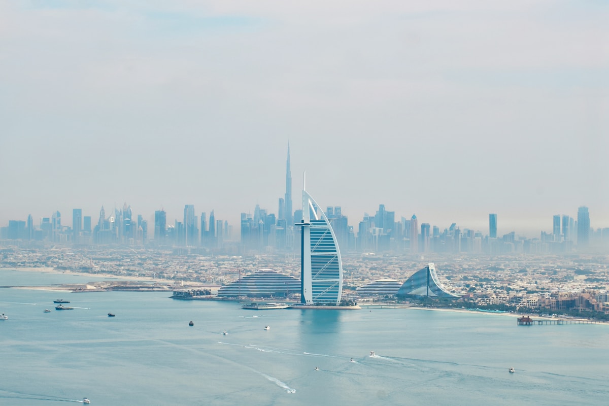 Aerial view of Burj Al Arab and Dubai skyline across the Arabian Gulf